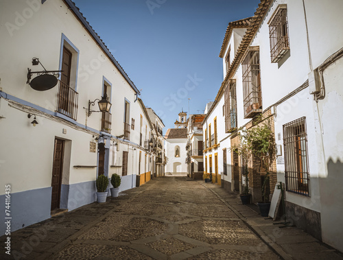 View of narrow empty cobblestone street called San Basilio in the historical old town of Cordoba, Andalusia, Spain, in the historical neighborhood photo