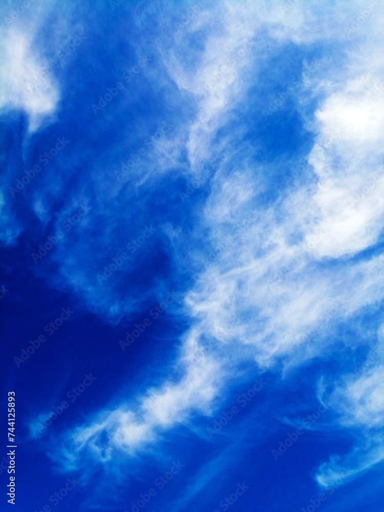 BLUE SKY WITH CLOUDS FOR THE BACKGROUND