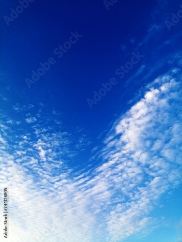 BLUE SKY WITH CLOUDS FOR THE BACKGROUND