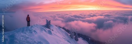 A mountaineer enjoys the sunrise from a snowy mountain peak © Landscape Planet