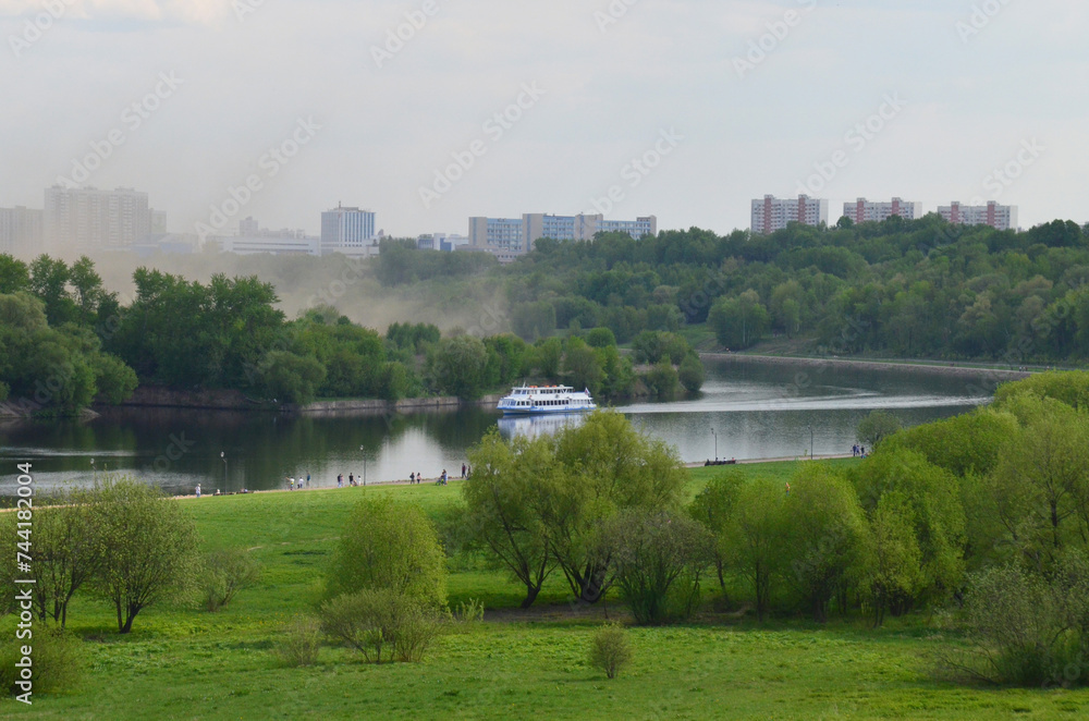 Kolomenskoye Nature Reserve Park. Panoramic view of the Moskva River from above. A misty summer landscape.
