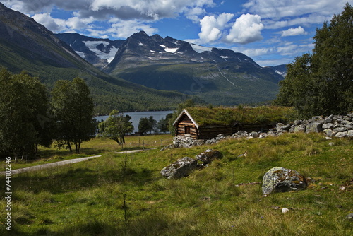 Old wooden cottage with green roof in Innerdalen valley, Norway, Europe
 photo