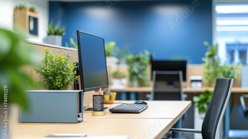 Modern office workspace with blue walls and green plants