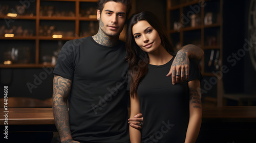 a man and woman who are wearing black t shirts