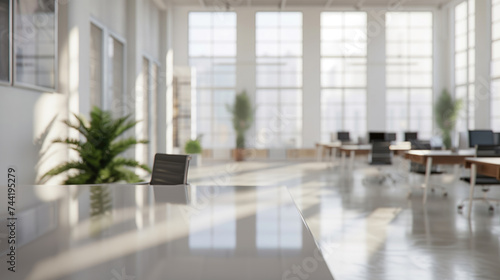 Bright corporate office with tall windows, modern desks, and lush indoor plants in a blurred background.