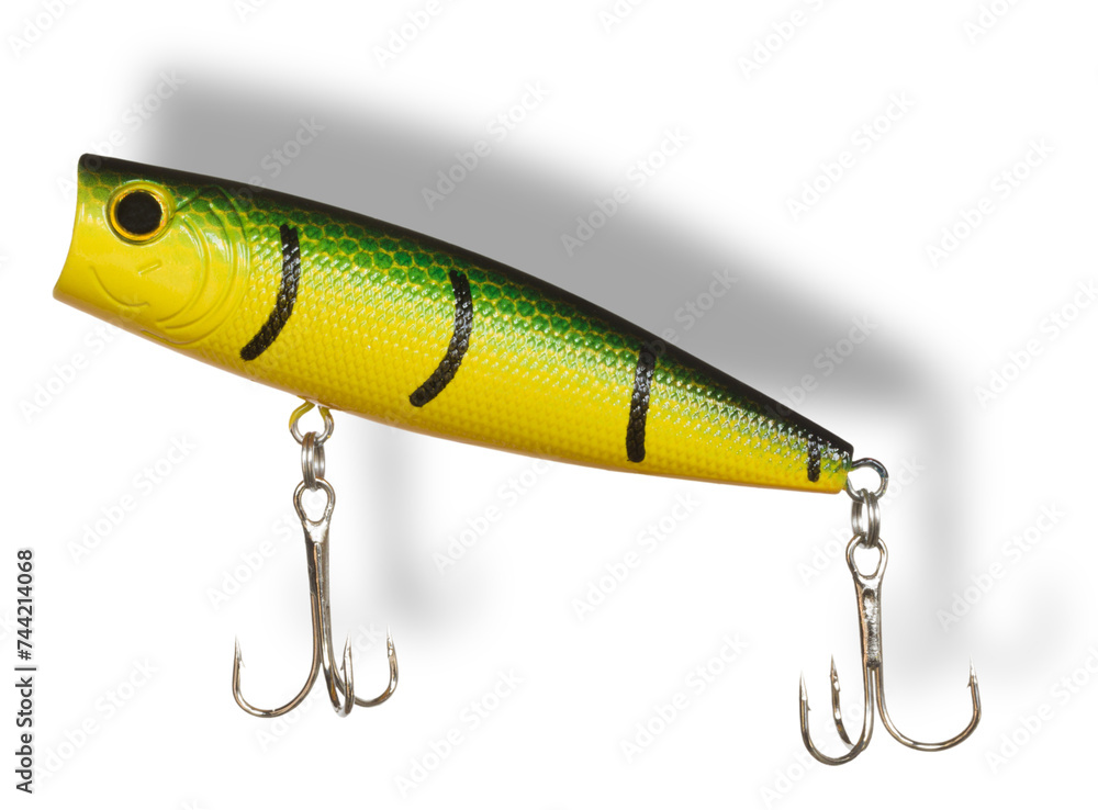 Shadow above and behind a topwater artificial fishing lure Shadow above and behind a topwater artificial fishing lure