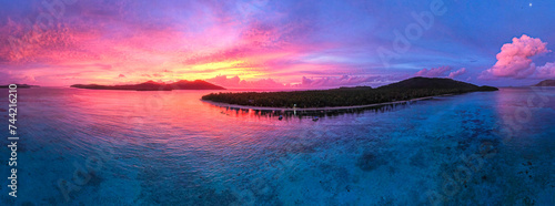 Sunset above tropical island in the Pacific - Fiji, Tavewa, Yasawa Islands photo
