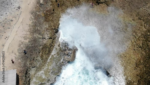 Aerial shot of Shete Boka National Park, Curacao with waves crashing into coves photo