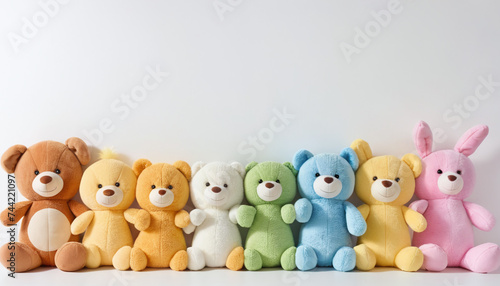 row of plush toys neatly lined up together on white background   © DemiourgosAI