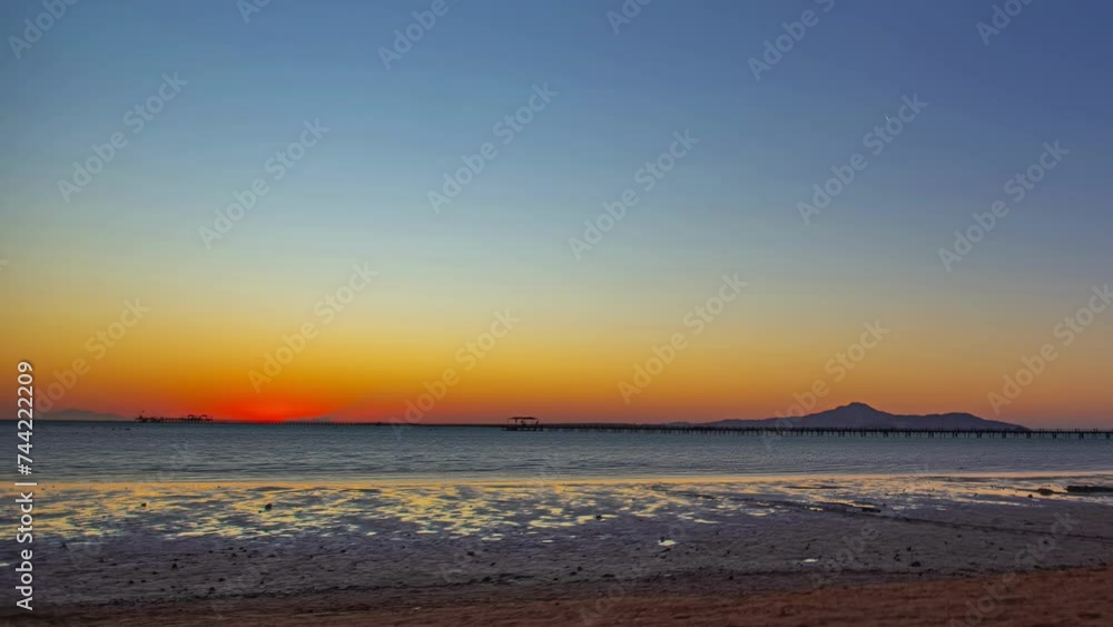 Colorful timelapse of sunrise over the red sea in Egypt on a clear day in Sharm El Sheikh Colorful timelapse of sunrise over the red sea in Egypt on a clear day in Sharm El Sheikh