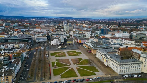 Aerial around the downtown of the city Kassel in Germany on a cloudy day in winter 