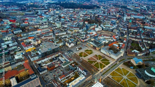 Aerial around the downtown of the city Kassel in Germany on a cloudy day in winter 