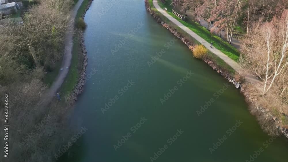 Pedestrian itinerary around Chateaugiron pond, Brittany in France. Aerial top-down forward