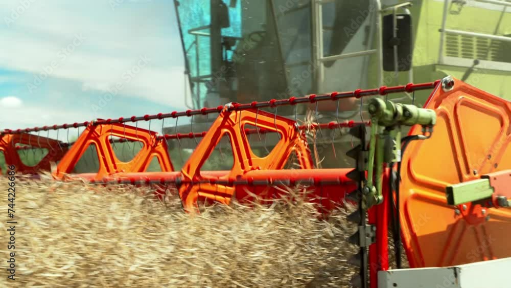 Farmer On Harvester Machine Cuts Crop In Field. Green Combine Harvesting, Collects Ripe Grains. Agriculture Food Production. Farmer On Harvester Machine Cuts Crop In Field. Green Combine Harvesting, Collects Ripe Grains. Agriculture Food Production.