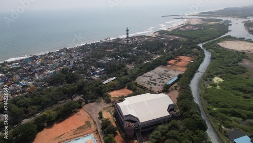 Aerial footage displays the breathtaking Bay of Bengal coastline in addition to the entire city of Puducherry. Early morning sky and sea. International beach resorts located on Ponducherry.Light house photo