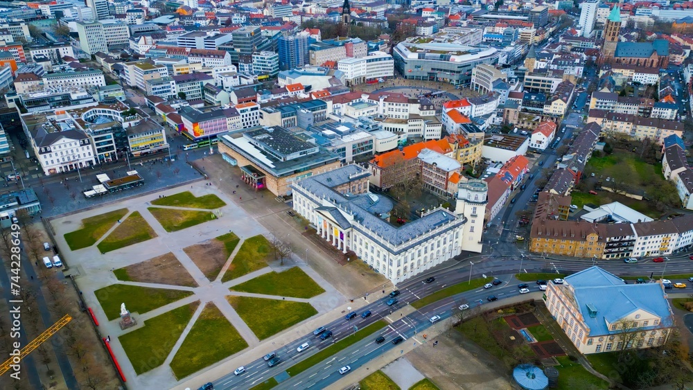 Aerial around the downtown of the city Kassel in Hessen, Germany on a cloudy day in early spring.	
