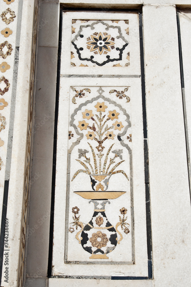 AGRA, UTTAR PRADESH / INDIA - FEBRUARY 27, 2012 : INLAID WORK OF MARBLE STONE ART ON WALL OF ITMAD UD DAUILA (BABY TAJ).