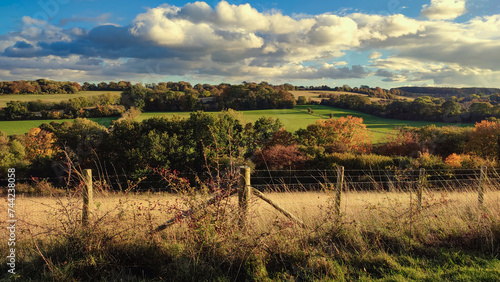 Autumn colorful landscape on a bright sunny day with beautiful clouds in the sky