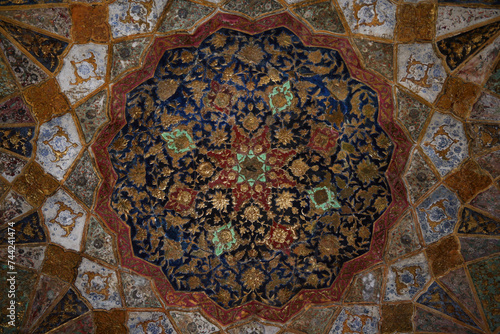 Photos Agra, Uttar Pradesh / India - February 27, 2012 : An inlaid work of colorful marble stones on the wall of Itimad-Ud-Daulah (Baby Taj) in Agra