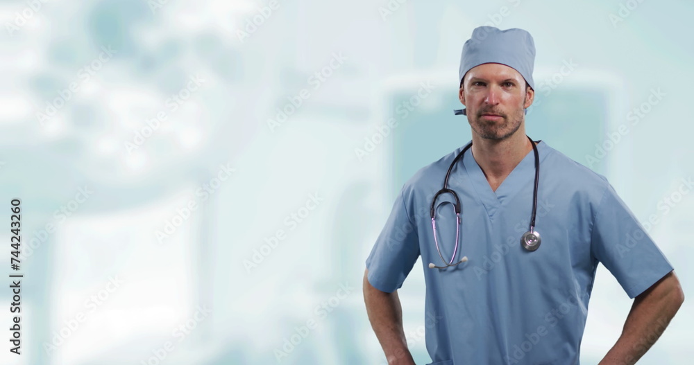Portrait of caucasian male surgeon with hands on his hips against hospital in background Portrait of caucasian male surgeon with hands on his hips against hospital in background