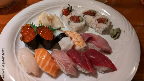 Sushi and Nigiri assortment japanese seafood meal on a white plate photo