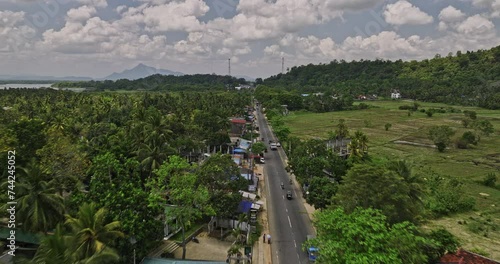 Ibbagamuwa Sri Lanka Aerial v1 drone flyover Kurunegala above Dambulla road capturing village town, lush jungle greenery and agricultural landscape along the way - Shot with Mavic 3 Cine - April 2023 photo