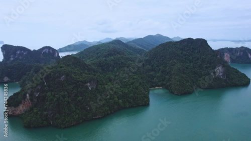 Aerial Top Down View at Kian Bay Cove Surrounded by Green Lush Trees on a Tropical Island Koh Yao Noi in Thailand. photo