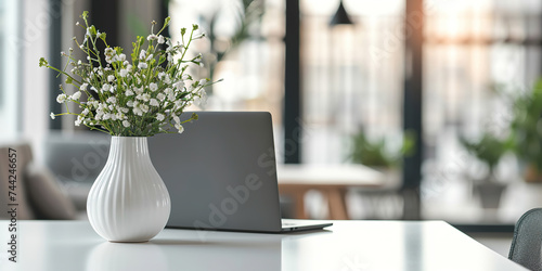 Close up view of simple workspace with laptop photo