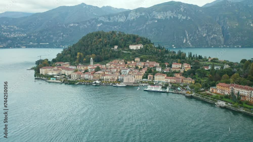 AERIAL: Boat Sails to Port of Bellagio Town in Lake Como AERIAL: Boat Sails to Port of Bellagio Town in Lake Como