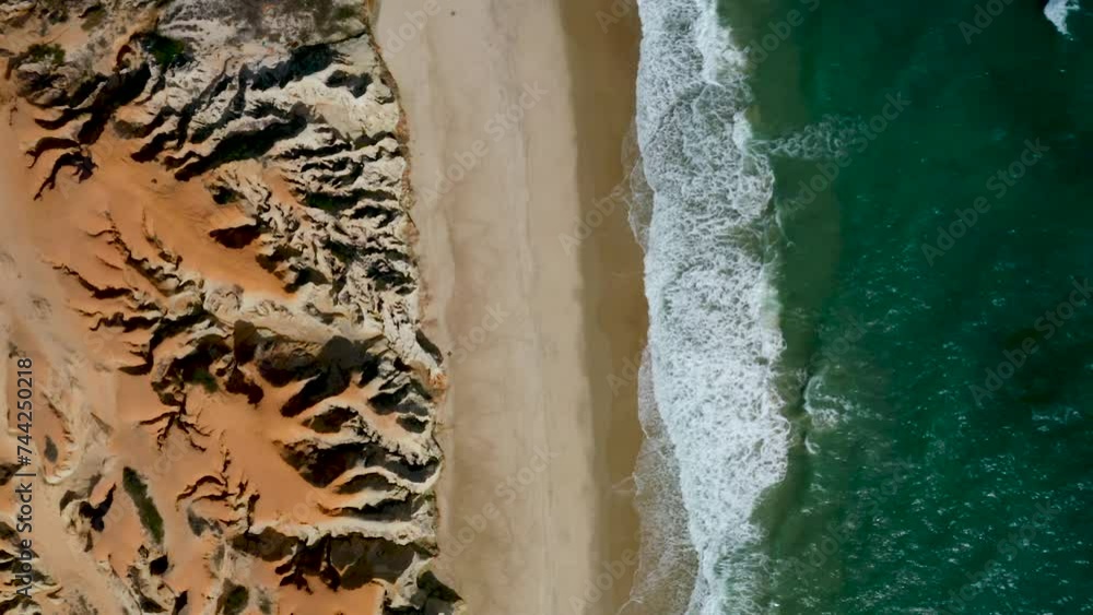 Aerial view of the sea, waves and the cliffs of Morro Branco, Ceara, Brazil Aerial view of the sea, waves and the cliffs of Morro Branco, Ceara, Brazil