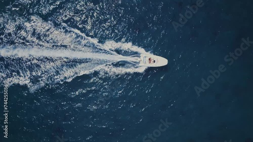 Wallpaper Mural Super speed white boat fast movement on dark water top view, fast moving white boat with people aerial view. Torontodigital.ca