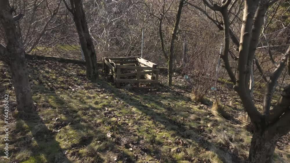 wooden pallet composter in garden. permaculture concept wooden pallet composter in garden. permaculture concept