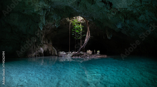 Underground caving and swimming in Sac Actun cave system in Tulum Mexico