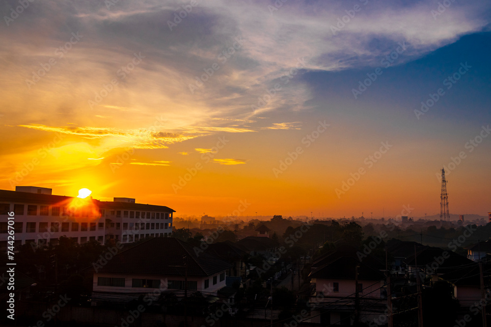 Beautiful golden colorful sunrise over the city panorama Pattaya Thailand.