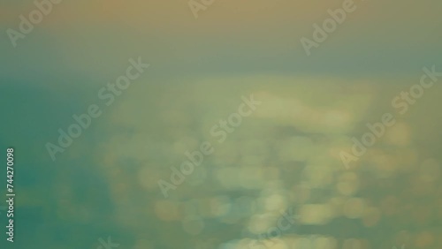 Ocean Water Surface. Motion Detail Of Smooth Waves Catching Sunny Highlights.