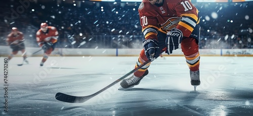 The Skillful Skating of an Ice Hockey Player in the Stadium Spotlight