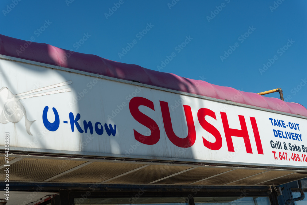 exterior sign of UKnow Sushi, a sushi restaurant, located at 170 The