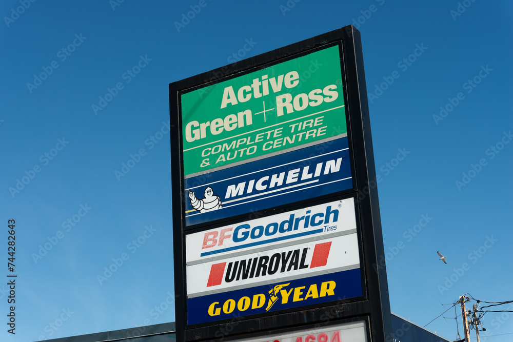 exterior pylon sign of Active Green + Ross Tire & Automotive Centre, a