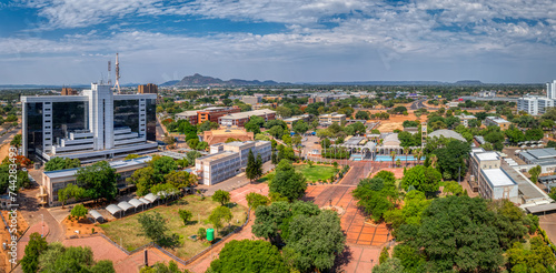 gaborone aerial view, government enclave and the bus rank with the department of immigration and the house of the parliament