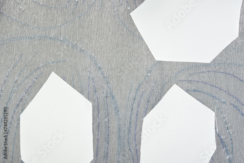 metallic crepe paper with blue lines and cutouts