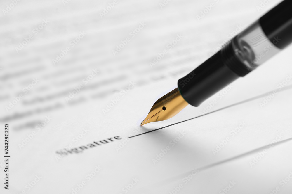 Signing notary document with fountain pen, closeup. Space for text Signing notary document with fountain pen, closeup. Space for text