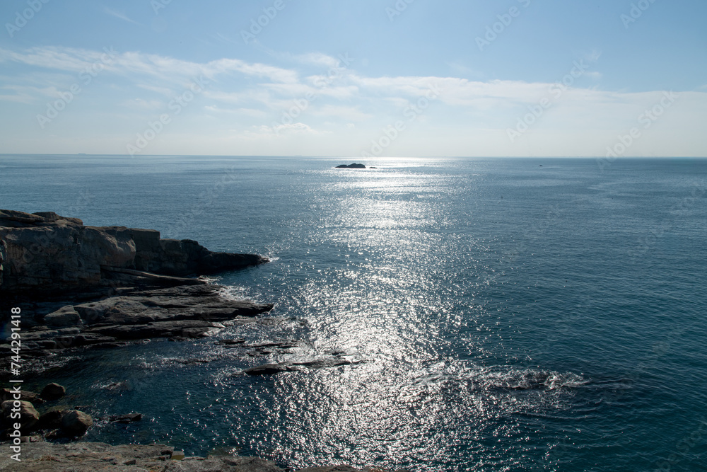 Seascape with rocks and horizon on a sunny day Seascape with rocks and horizon on a sunny day