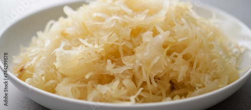 Freshly chopped onions in white bowl for cooking, seasoning, aromatics in kitchen
