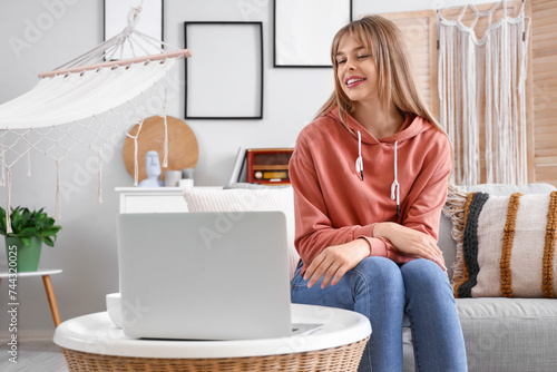 Teenage girl with laptop vi...