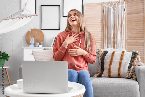 Teenage girl with laptop vi...