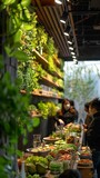 Customers enjoy a variety of fresh salads at a contemporary restaurant adorned with a lush vertical garden, offering a blend of taste and nature.