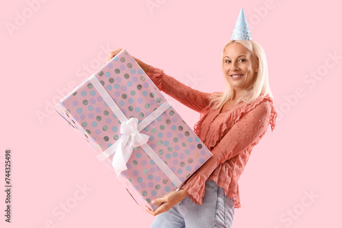 Happy mature woman in party...