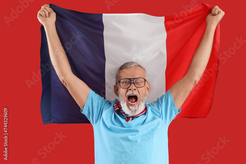 Senior man with flag of Fra...