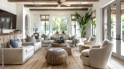 beautiful small space casual living family room soft neutral wood beams and a gorgeous grouping of swivel color fabric chairs around a striking coffee table coastal design nature freshness photo