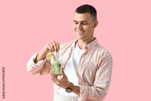 Young male bartender with g...